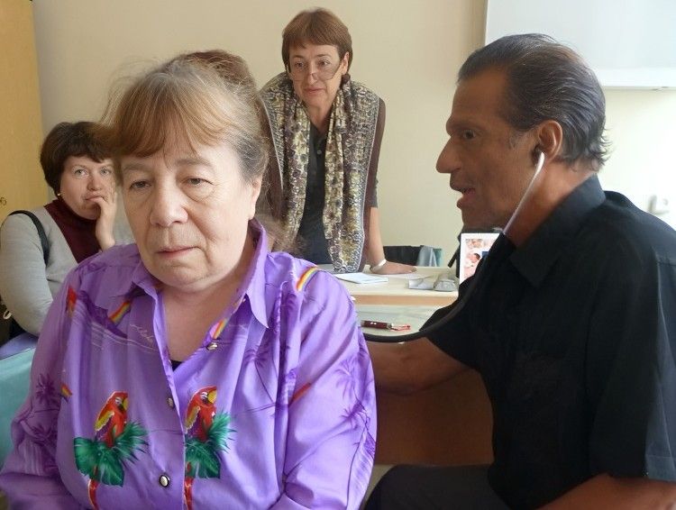 Dr. PK examining a patient with a stethoscope